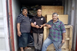 Container of disaster relief aid being unpacked in Tonga Small